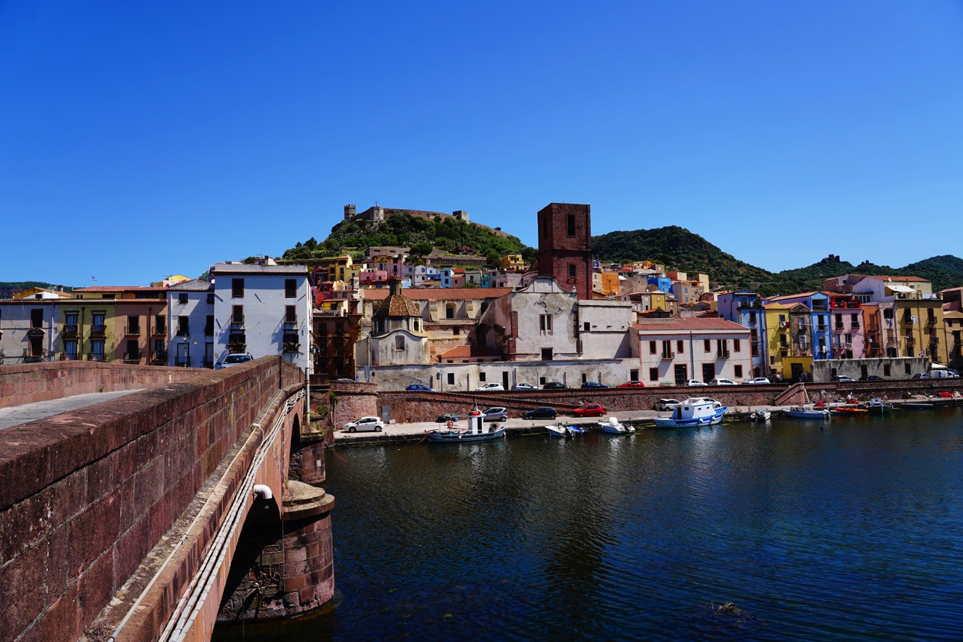 Colorful houses of Bosa viewed from the bridge over the Temo River in Sardinia.